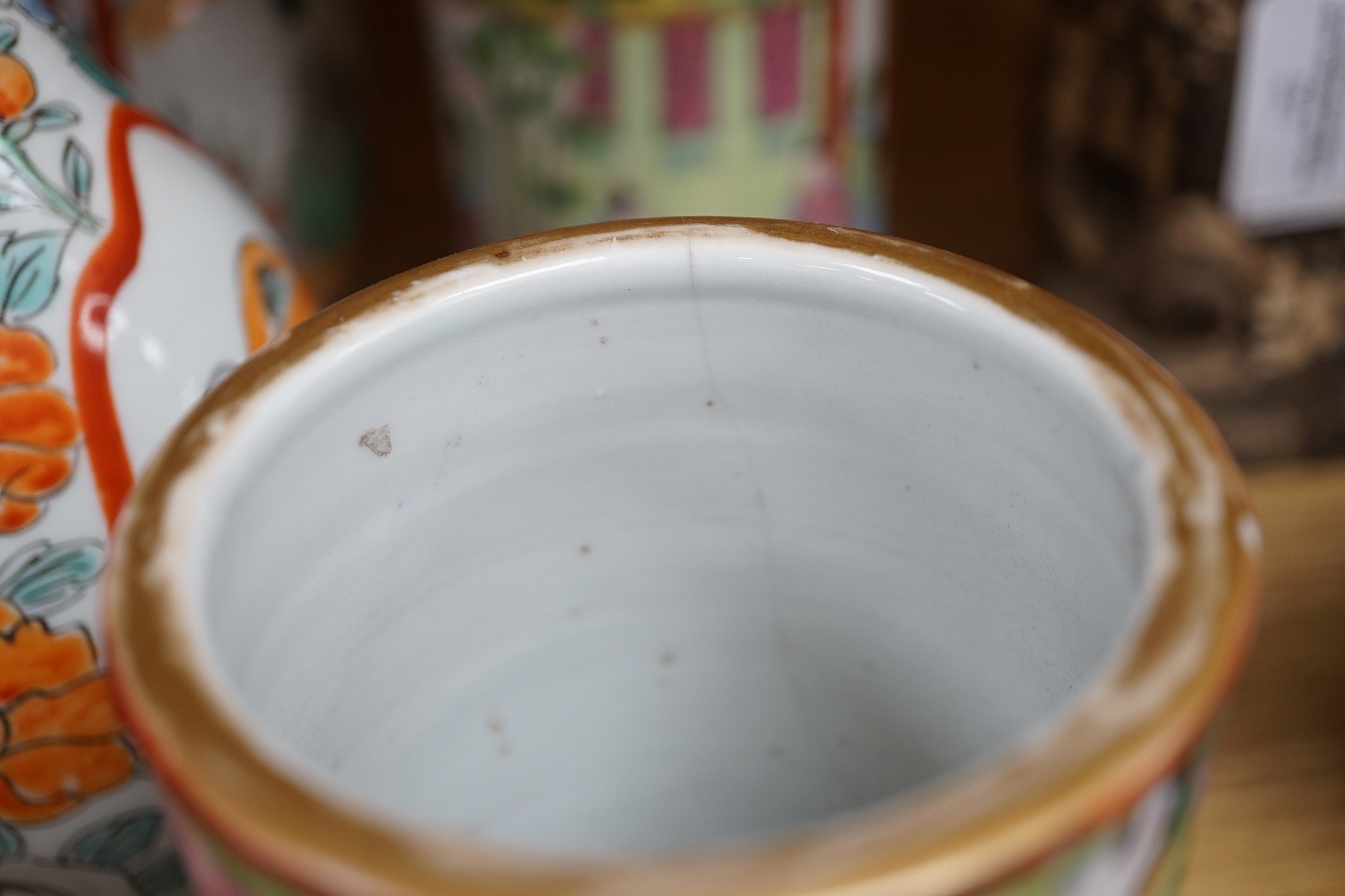 A pair of 19th century Cantonese famille rose porcelain brushpots, decorated with figural scenes, together with a further pair of Japanese export vases (4)
